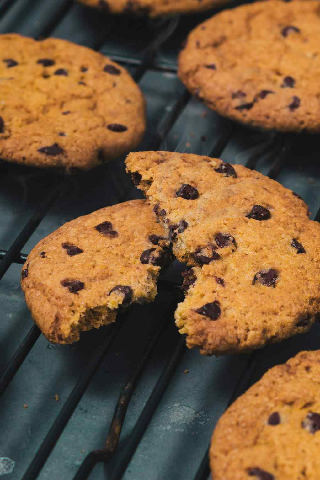 Photo of several cookies with the center one torn in half